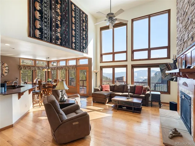 a living room with furniture or couch and a large window