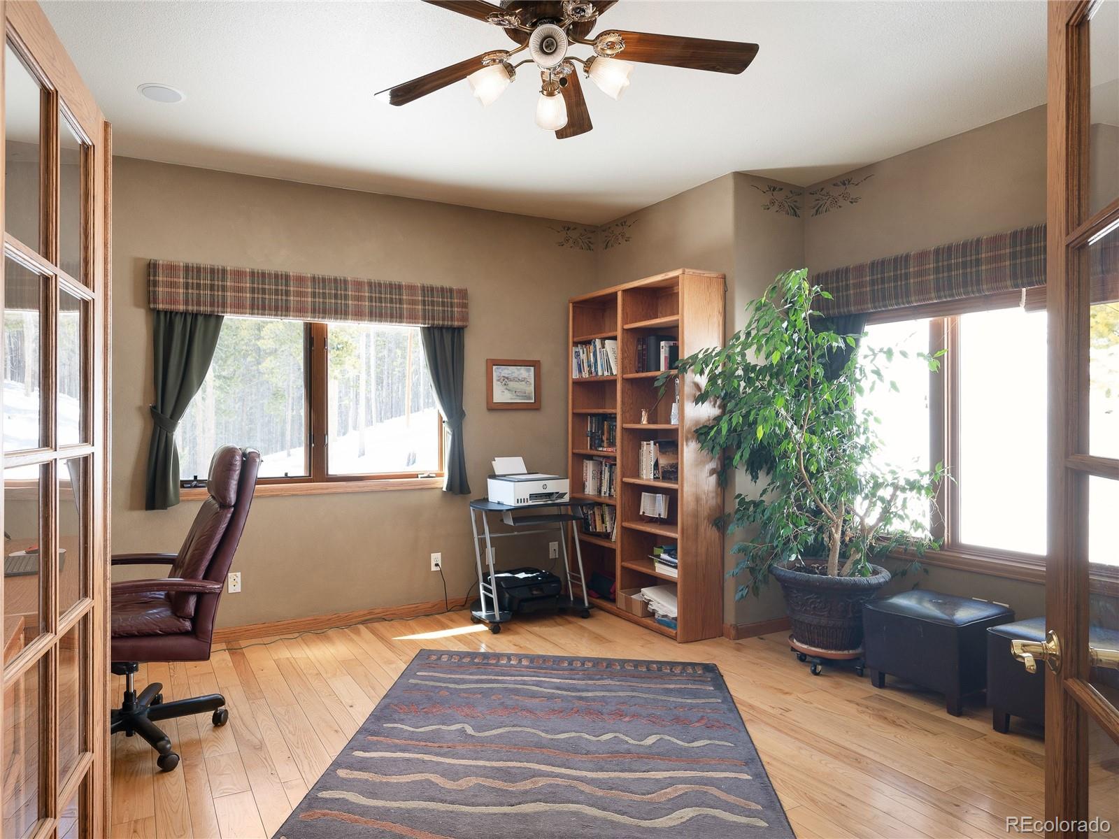 76 Raven Rdg Road Idaho Springs, CO 80452 - Photo 23 of 49 a bedroom with furniture and a window