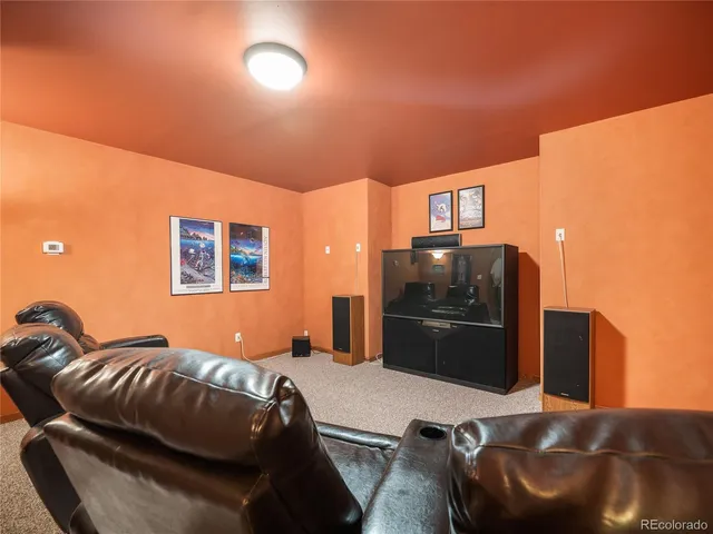 a bedroom with a bed and a television