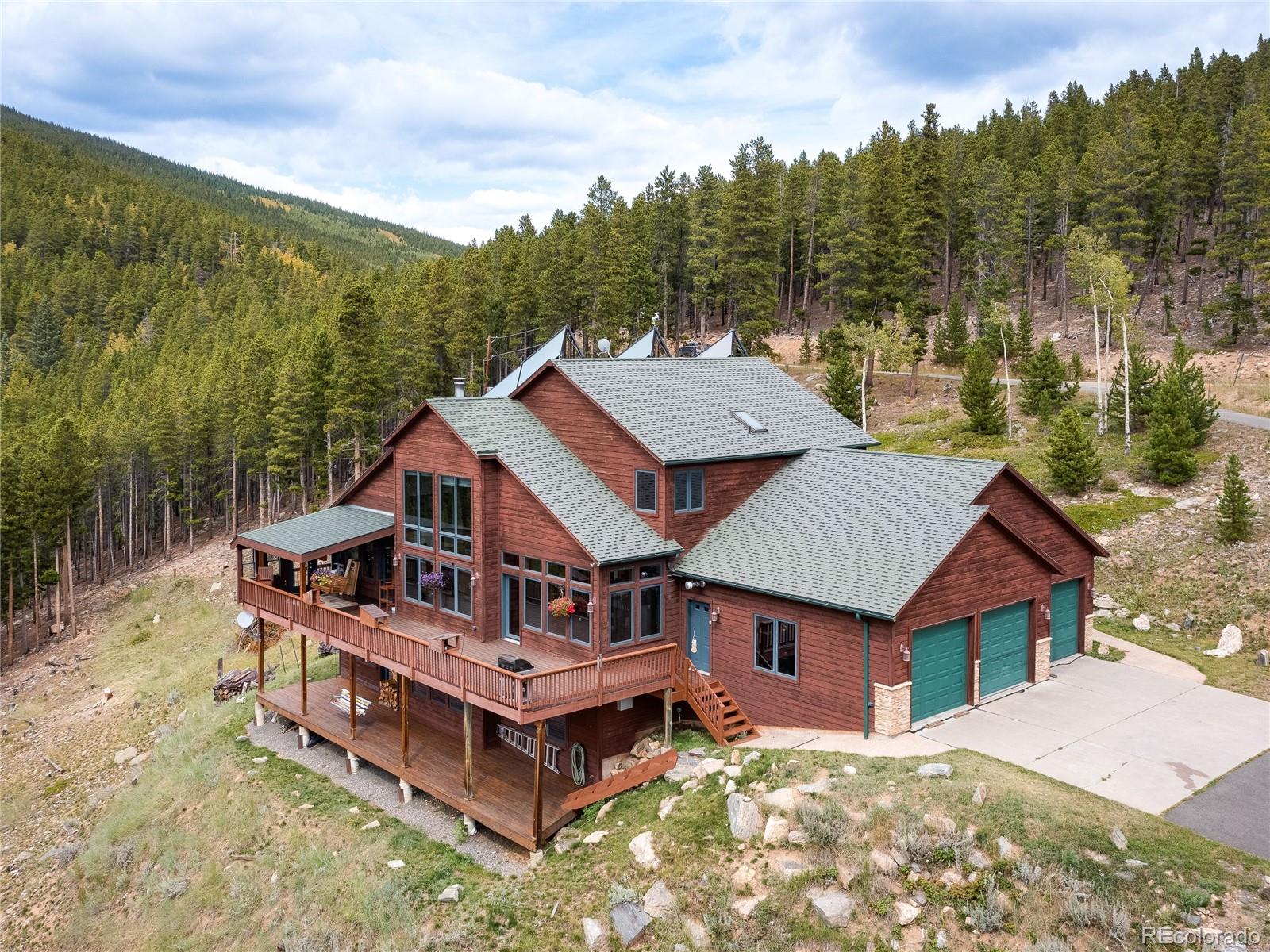76 Raven Rdg Road Idaho Springs, CO 80452 - Photo 43 of 49 an aerial view of a house with a big yard