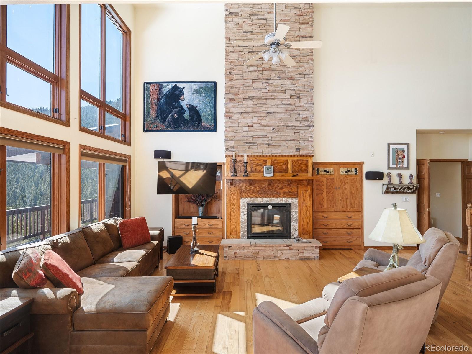 76 Raven Rdg Road Idaho Springs, CO 80452 - Photo 7 of 49 a outdoor living space with patio furniture and a fireplace