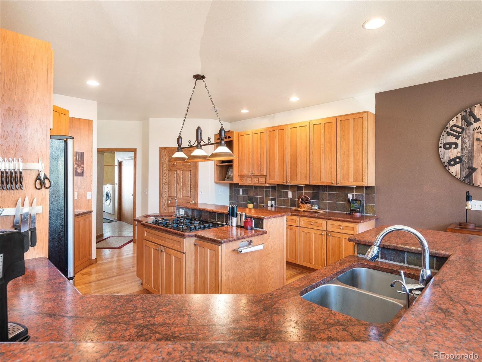 76 Raven Rdg Road Idaho Springs, CO 80452 - Photo 8 of 49 a kitchen with stainless steel appliances granite countertop a sink stove and refrigerator