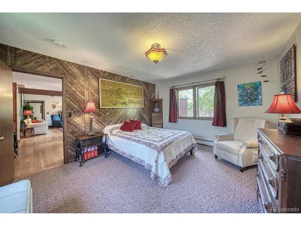 a bedroom with a bed and a couch