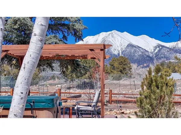 a aerial view of a chairs and table in the patio