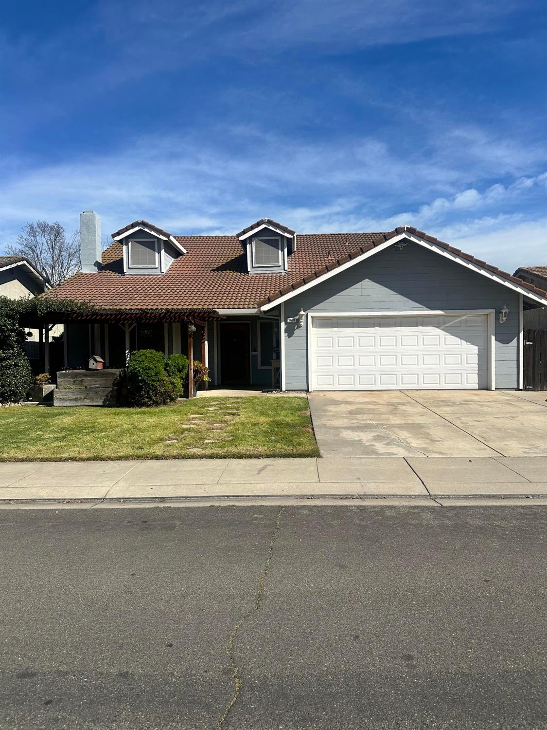 3608 Cassie Lane Ceres, CA 95307 - Photo 1 of 25 a front view of a house with a yard