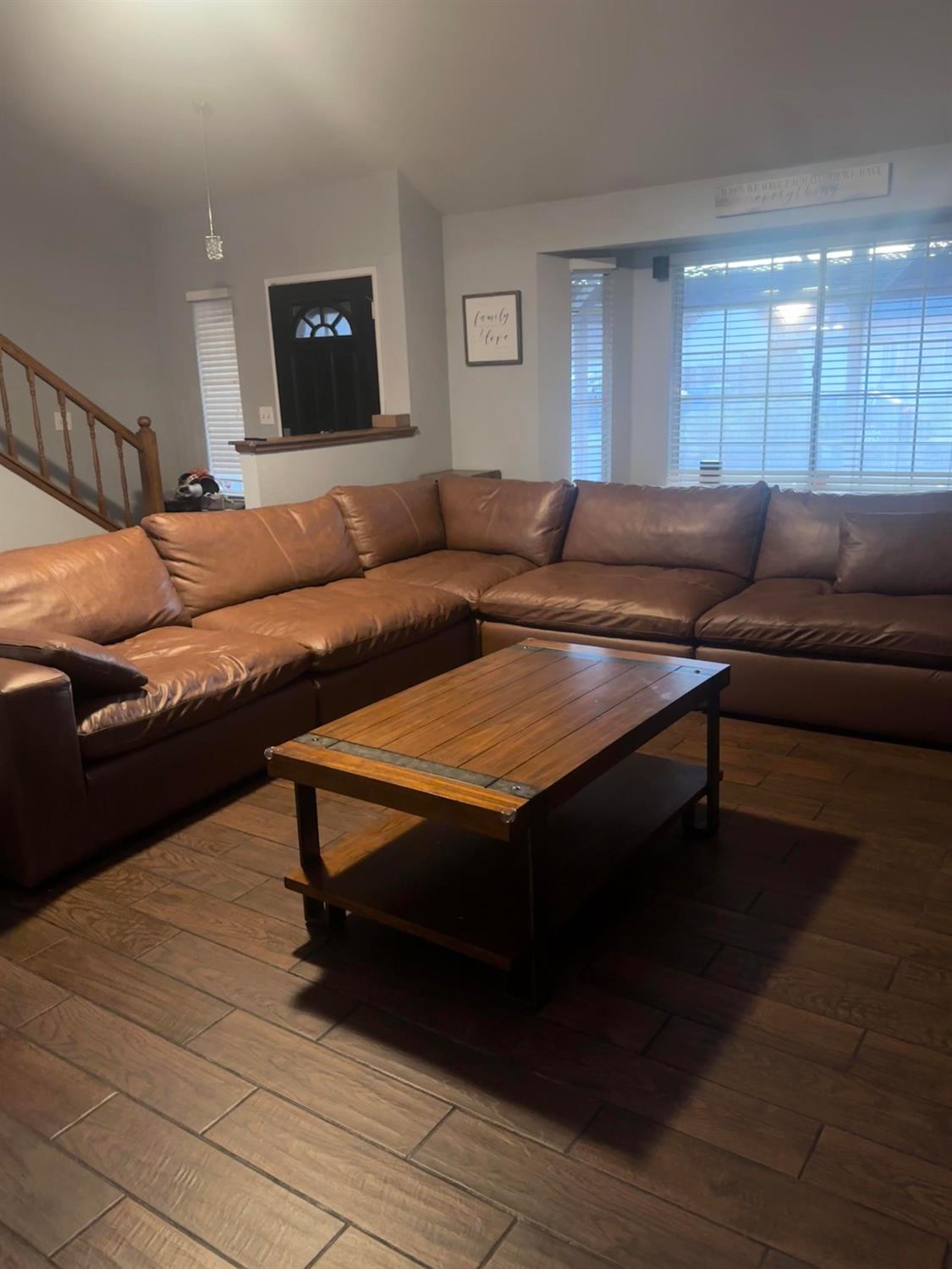 3608 Cassie Lane Ceres, CA 95307 - Photo 12 of 25 a living room with furniture a rug and a flat screen tv