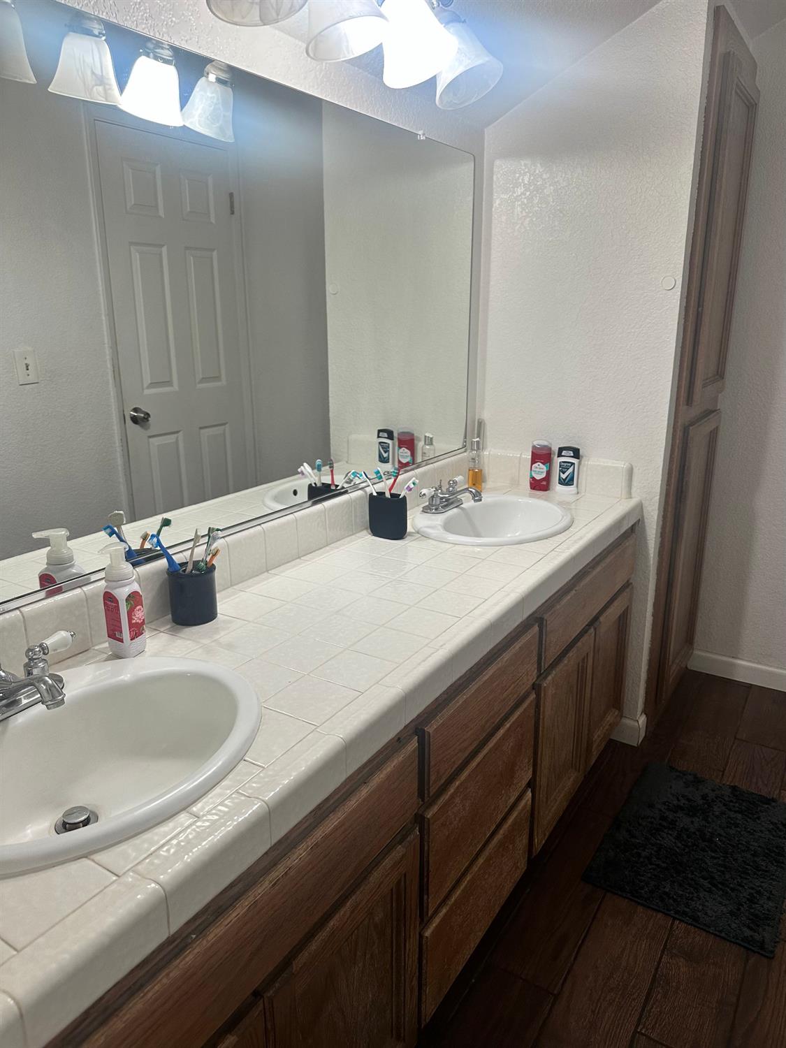 3608 Cassie Lane Ceres, CA 95307 - Photo 21 of 25 a bathroom with a sink and a mirror