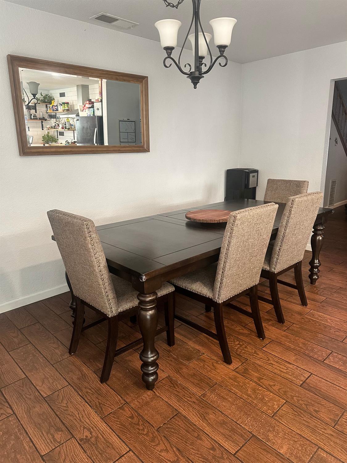 3608 Cassie Lane Ceres, CA 95307 - Photo 23 of 25 a view of a dining room with furniture and wooden floor