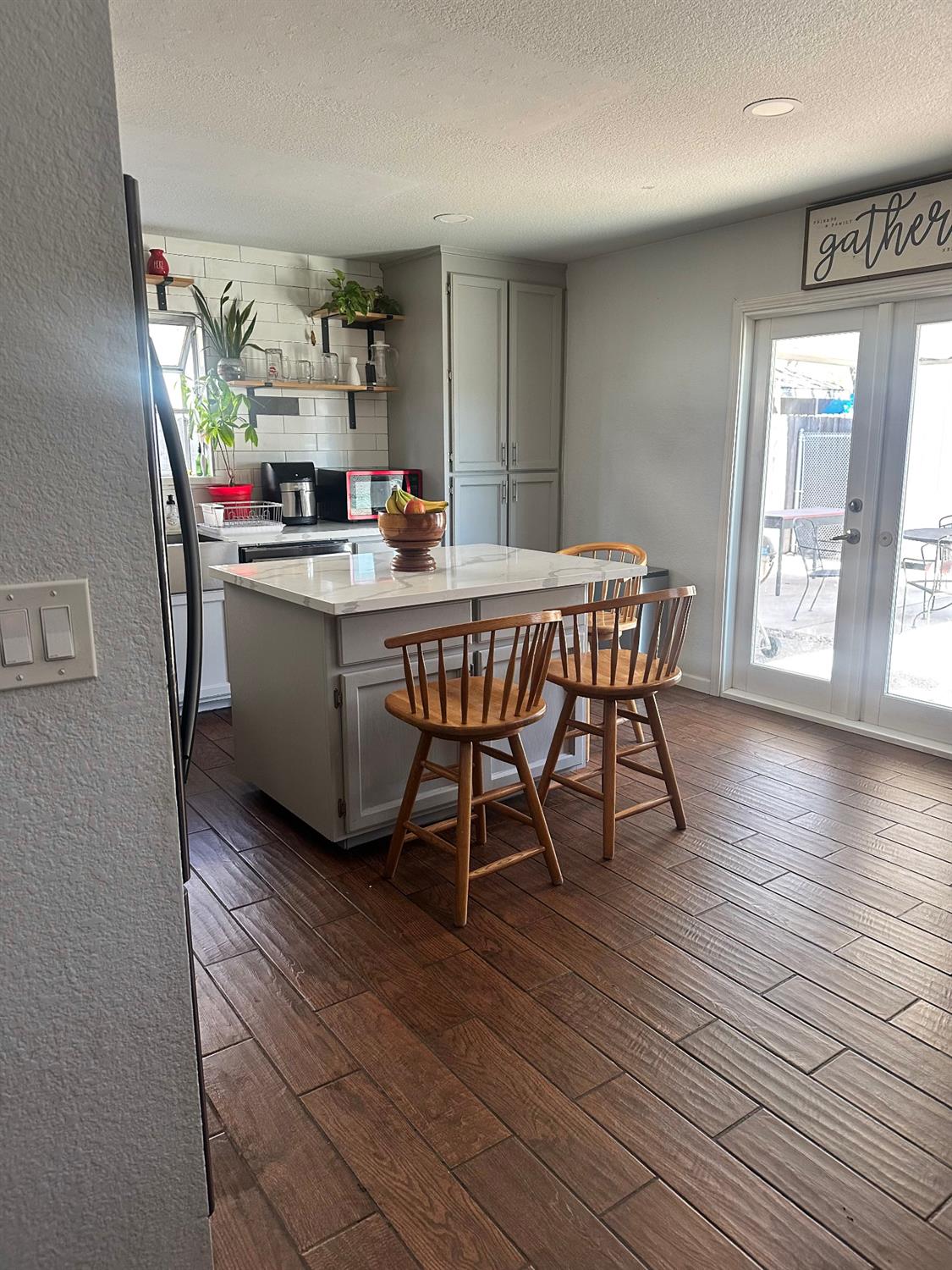 3608 Cassie Lane Ceres, CA 95307 - Photo 24 of 25 a room with wooden floor table and chairs
