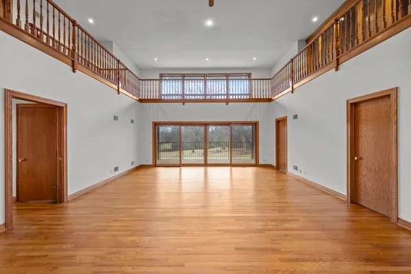 a view of balcony with wooden floor
