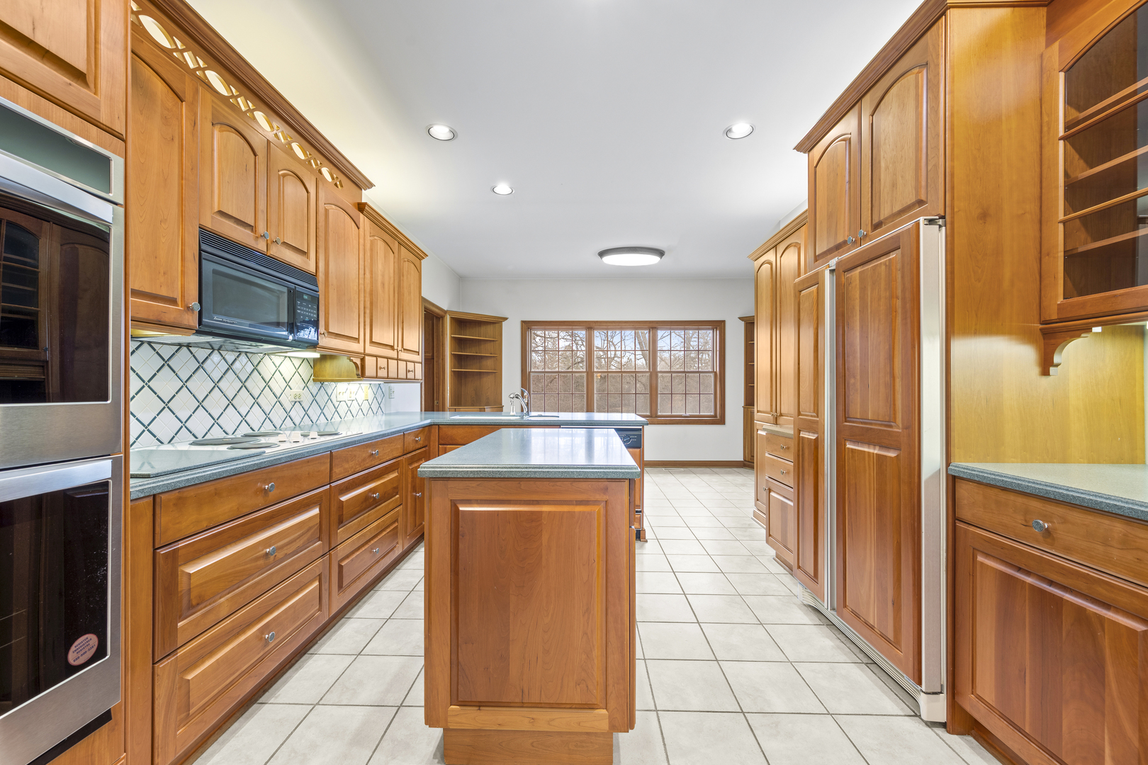 32981 North River Road Libertyville, IL 60048 - Photo 14 of 44 a view of a kitchen with a sink and cabinets