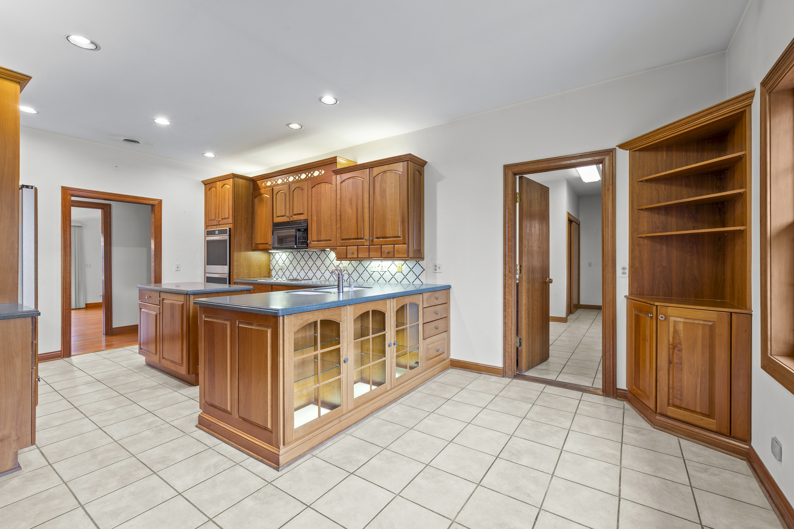 32981 North River Road Libertyville, IL 60048 - Photo 17 of 44 a kitchen with stainless steel appliances granite countertop a stove and a refrigerator