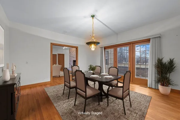a kitchen with stainless steel appliances granite countertop a refrigerator a sink and dishwasher with wooden cabinets