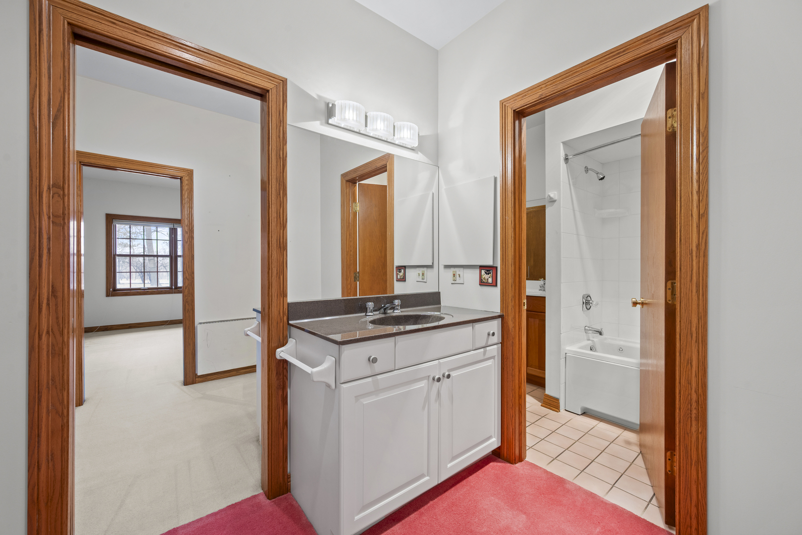32981 North River Road Libertyville, IL 60048 - Photo 29 of 44 a hallway with white cabinets and sink