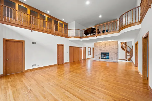 a view of an entryway with wooden floor