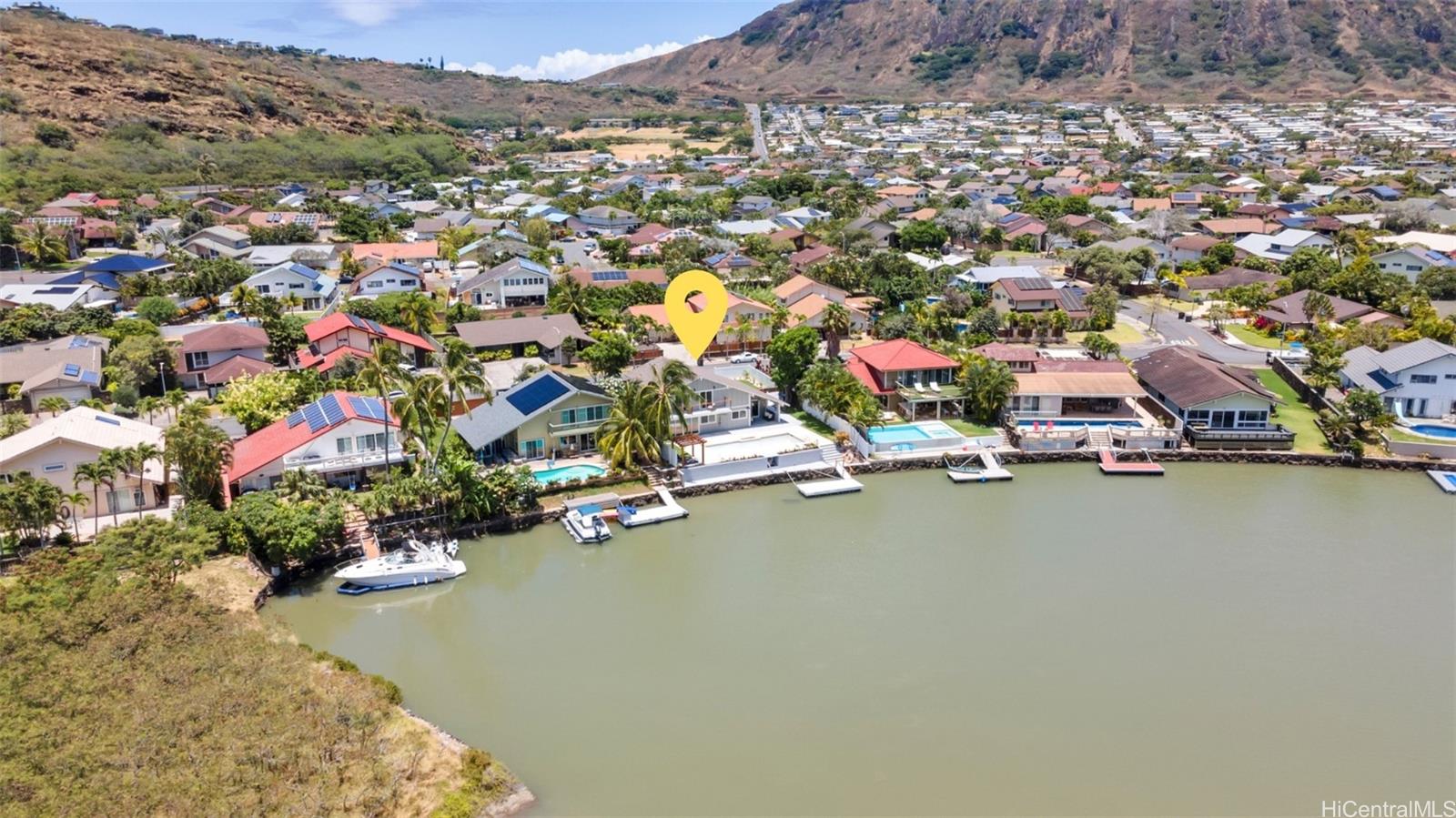 an aerial view of a houses with a lake view