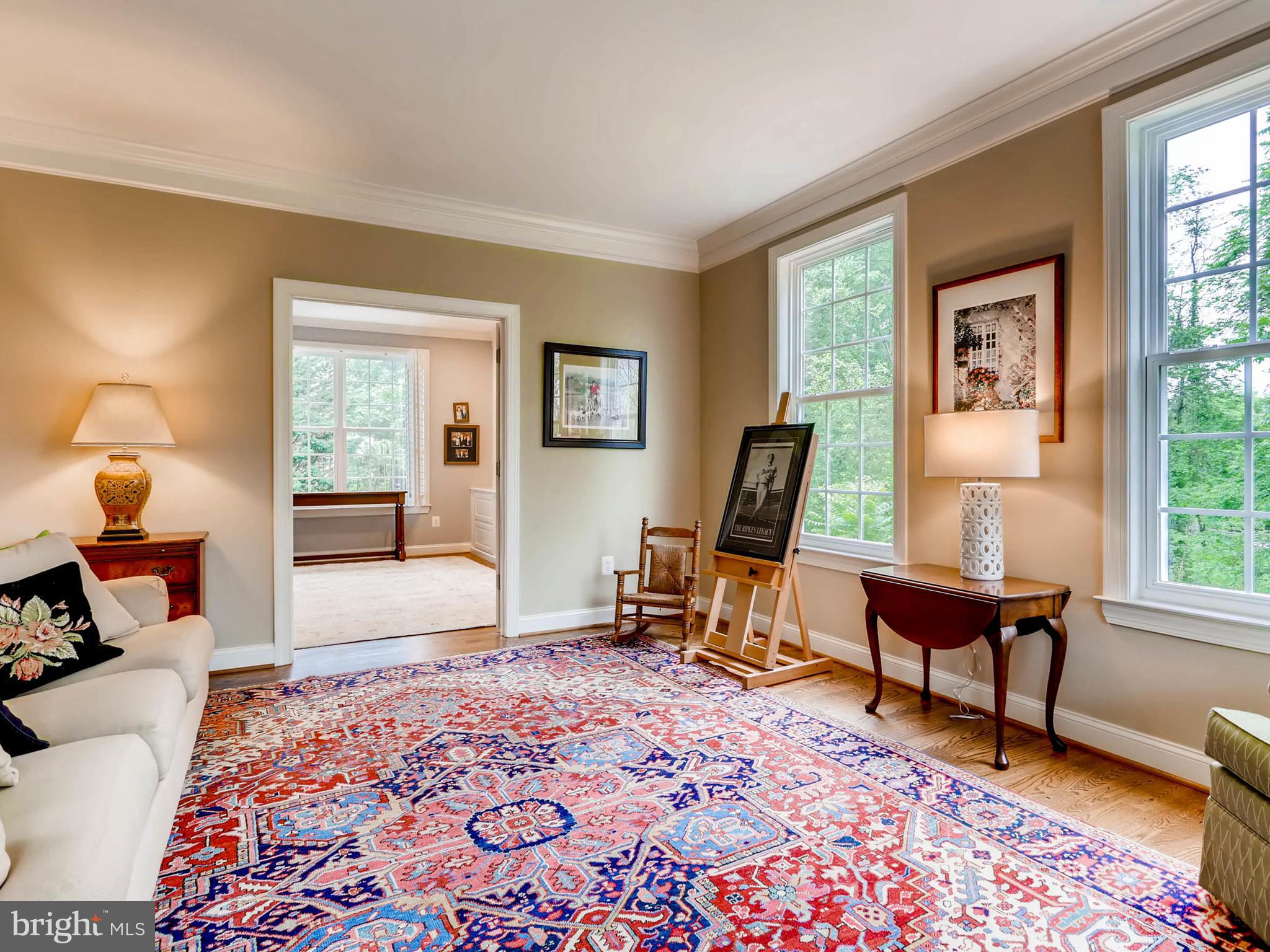 Light filled living room with entrance to study