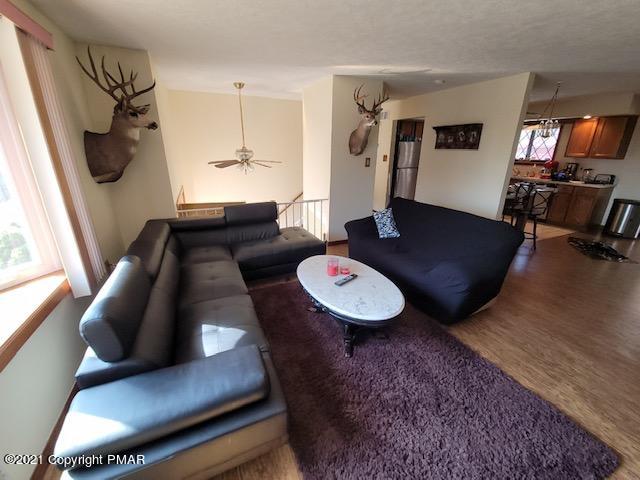 169 Murphy Circle Bushkill, PA 18324 - Photo 10 of 35 a living room with furniture and a flat screen tv