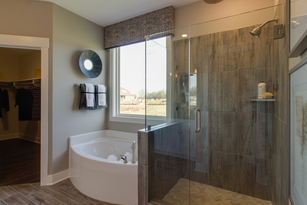 1715 Merkel Road West Columbia, TN 38401 - Photo 24 of 70 a bathroom with a bathtub and a shower