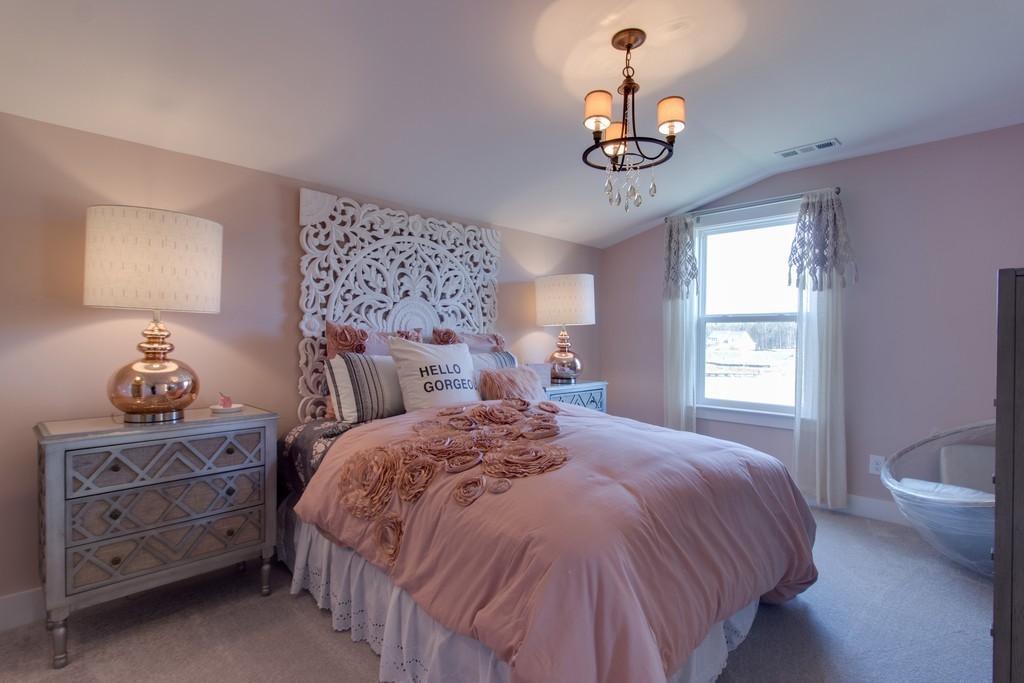 1715 Merkel Road West Columbia, TN 38401 - Photo 32 of 70 a bedroom with a bed a chandelier and a window
