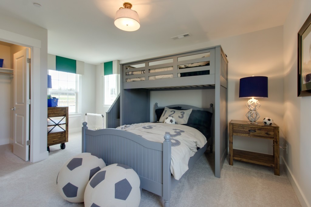 1715 Merkel Road West Columbia, TN 38401 - Photo 36 of 70 a bedroom with a bed and a chandelier