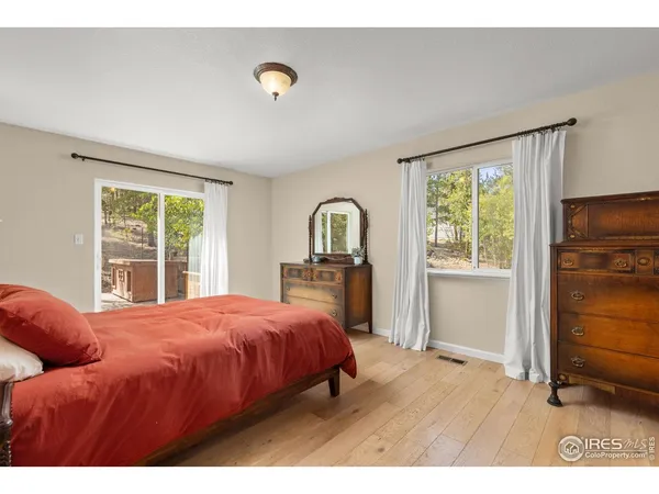 a bedroom with a bed and a lamp