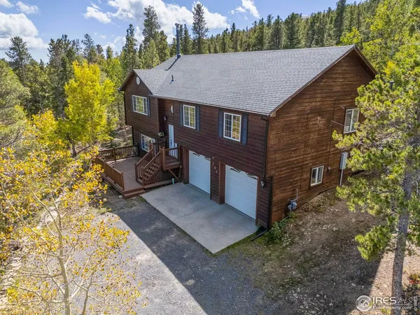 a aerial view of a house with a yard