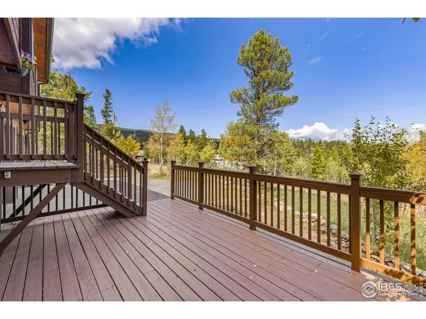 a view of a balcony with wooden floor