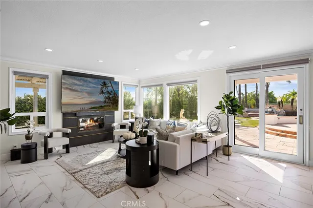 a view of a balcony with wooden floor and outdoor seating