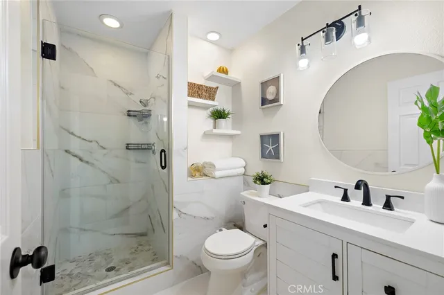 a bathroom with a tub mirror and window