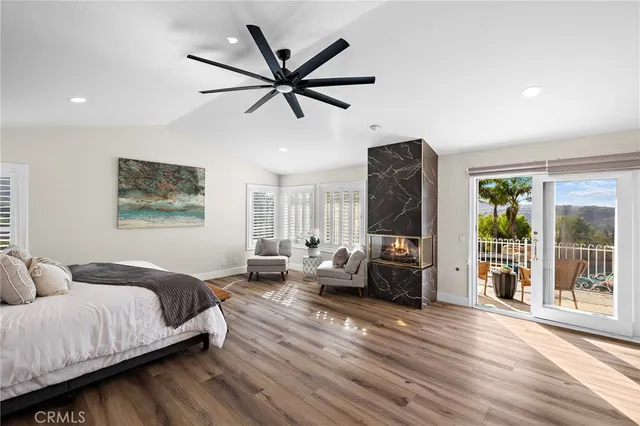 a view of a house with swimming pool and sitting area