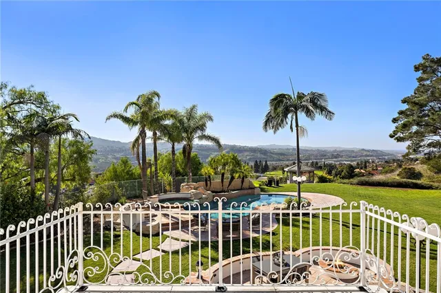 a view of a swimming pool with a patio