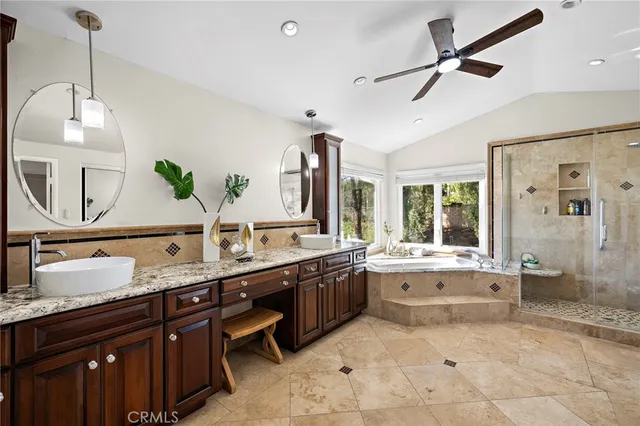 a view of a house with garden and sitting area