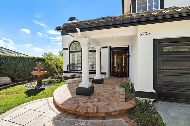 a view of a swimming pool and lounge chairs