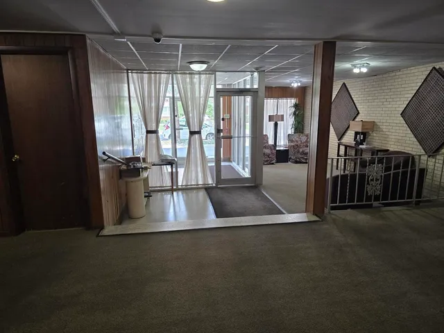 a view of an empty room with a window