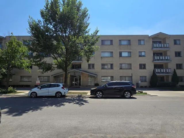 a view of a street with a building in the background