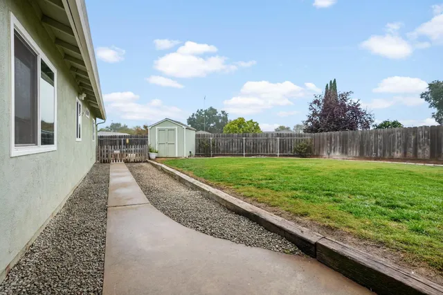 a view of a backyard with green space