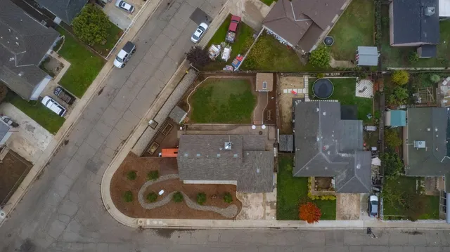 an aerial view of houses with outdoor space