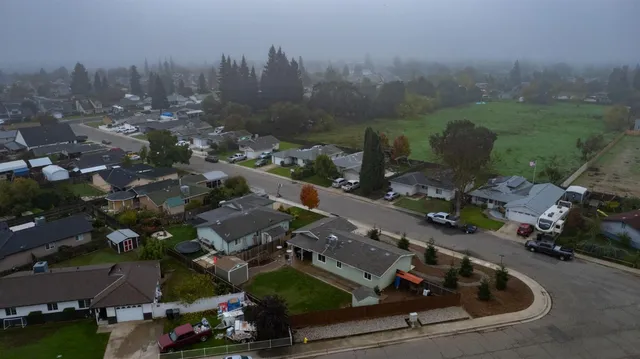 an aerial view of residential house with outdoor space