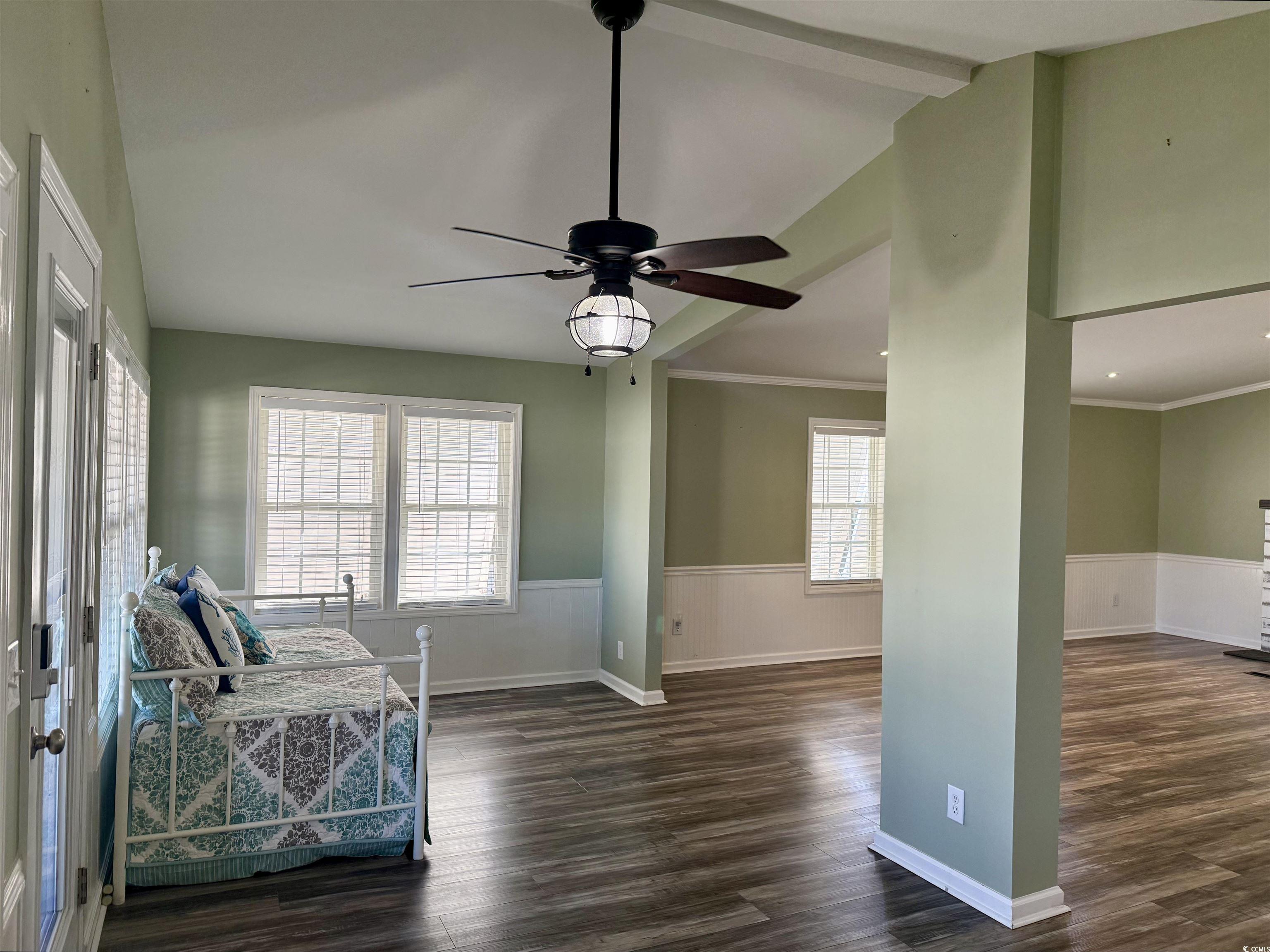 465 Sandpebble Surfside Beach, SC 29575 - Photo 9 of 40 Sitting room with wainscoting, dark wood-style flooring, crown molding, and ceiling fan
