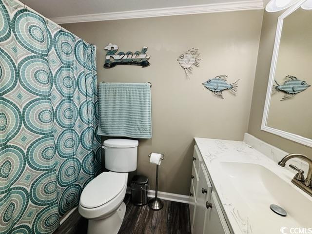 465 Sandpebble Surfside Beach, SC 29575 - Photo 13 of 40 Full bath with ornamental molding, wood finished floors, vanity, and a shower with curtain