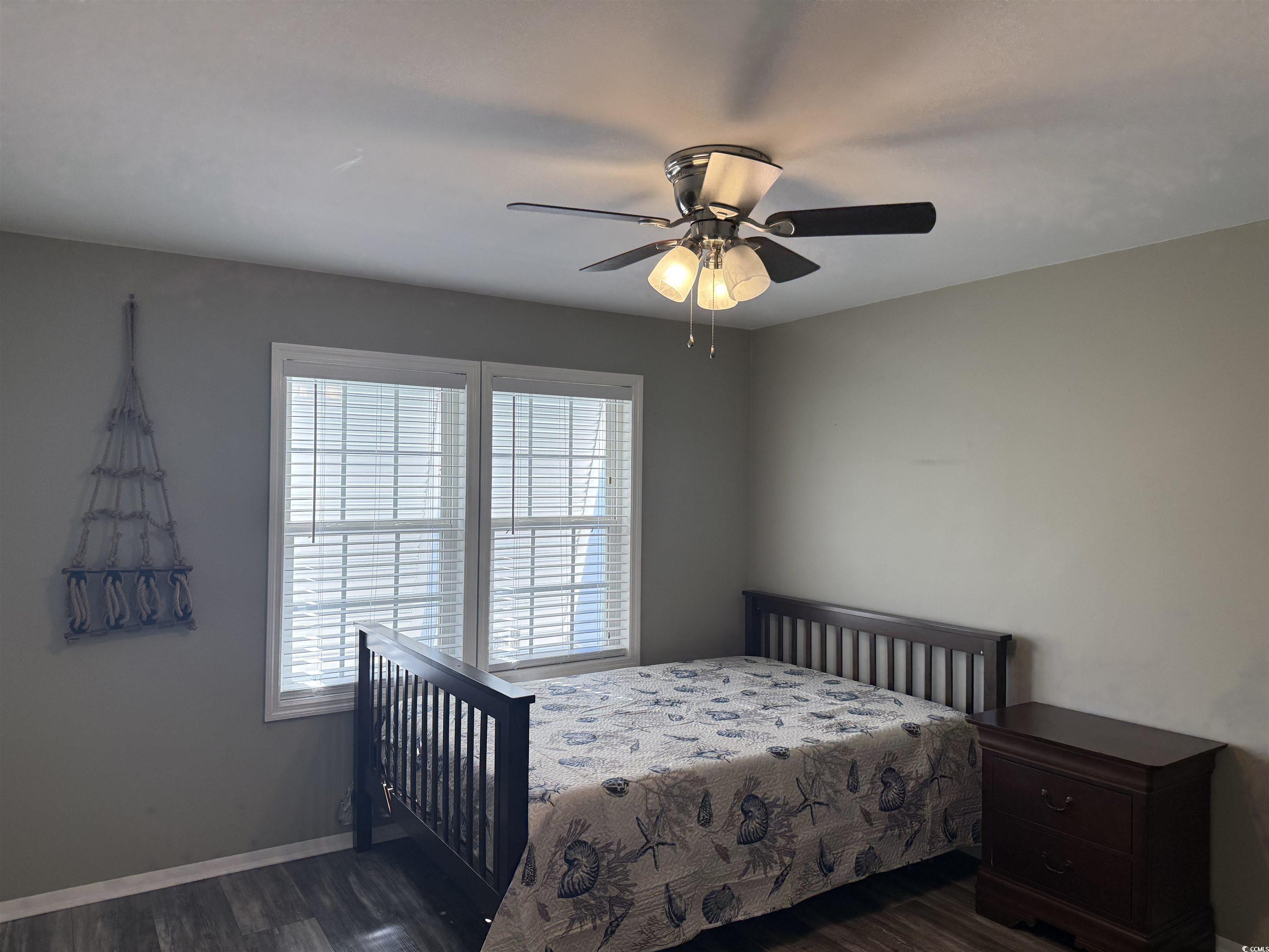 465 Sandpebble Surfside Beach, SC 29575 - Photo 17 of 40 Bedroom featuring dark wood-style flooring and ceiling fan