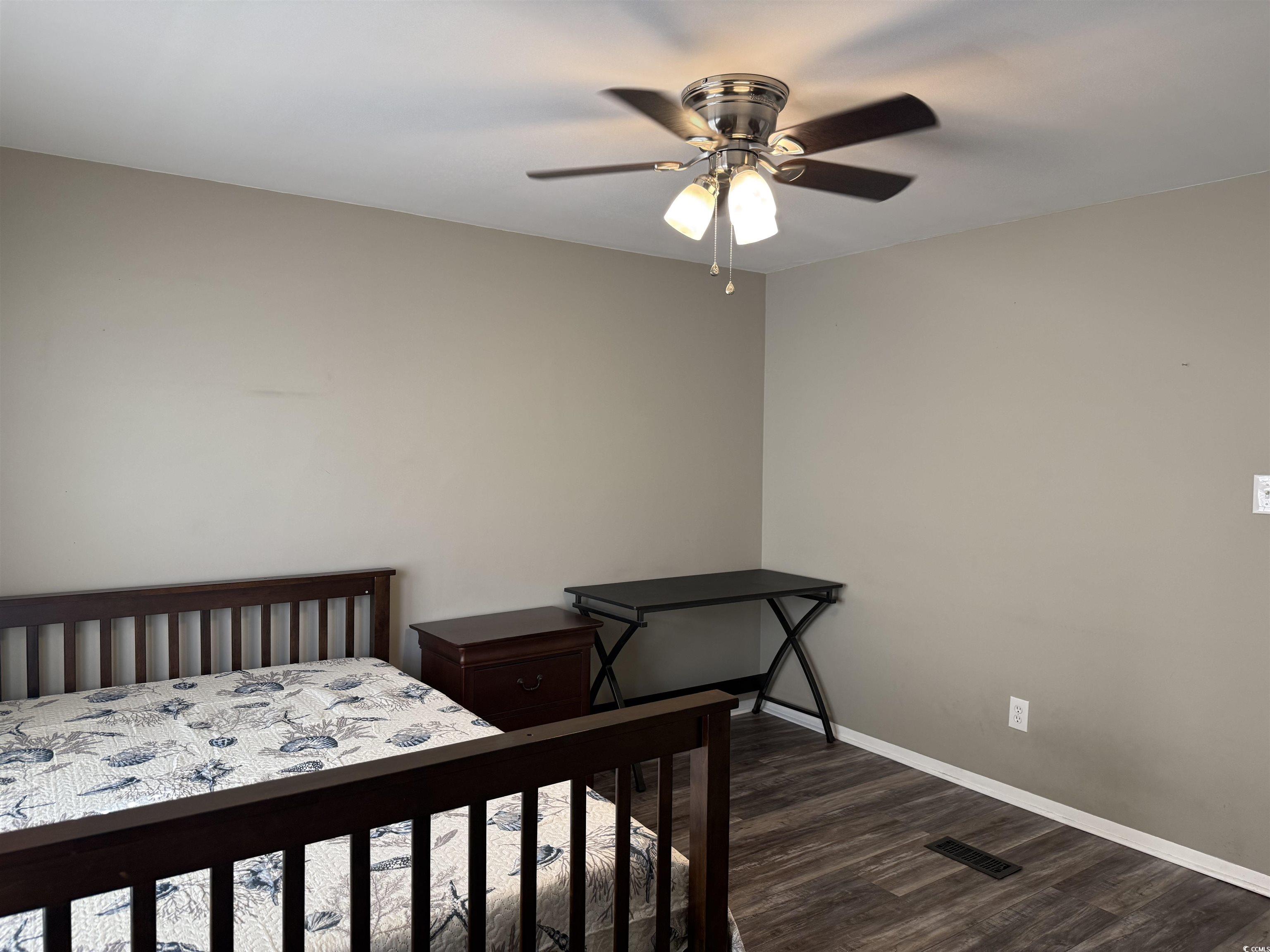 465 Sandpebble Surfside Beach, SC 29575 - Photo 18 of 40 Bedroom with dark wood-style flooring and ceiling fan