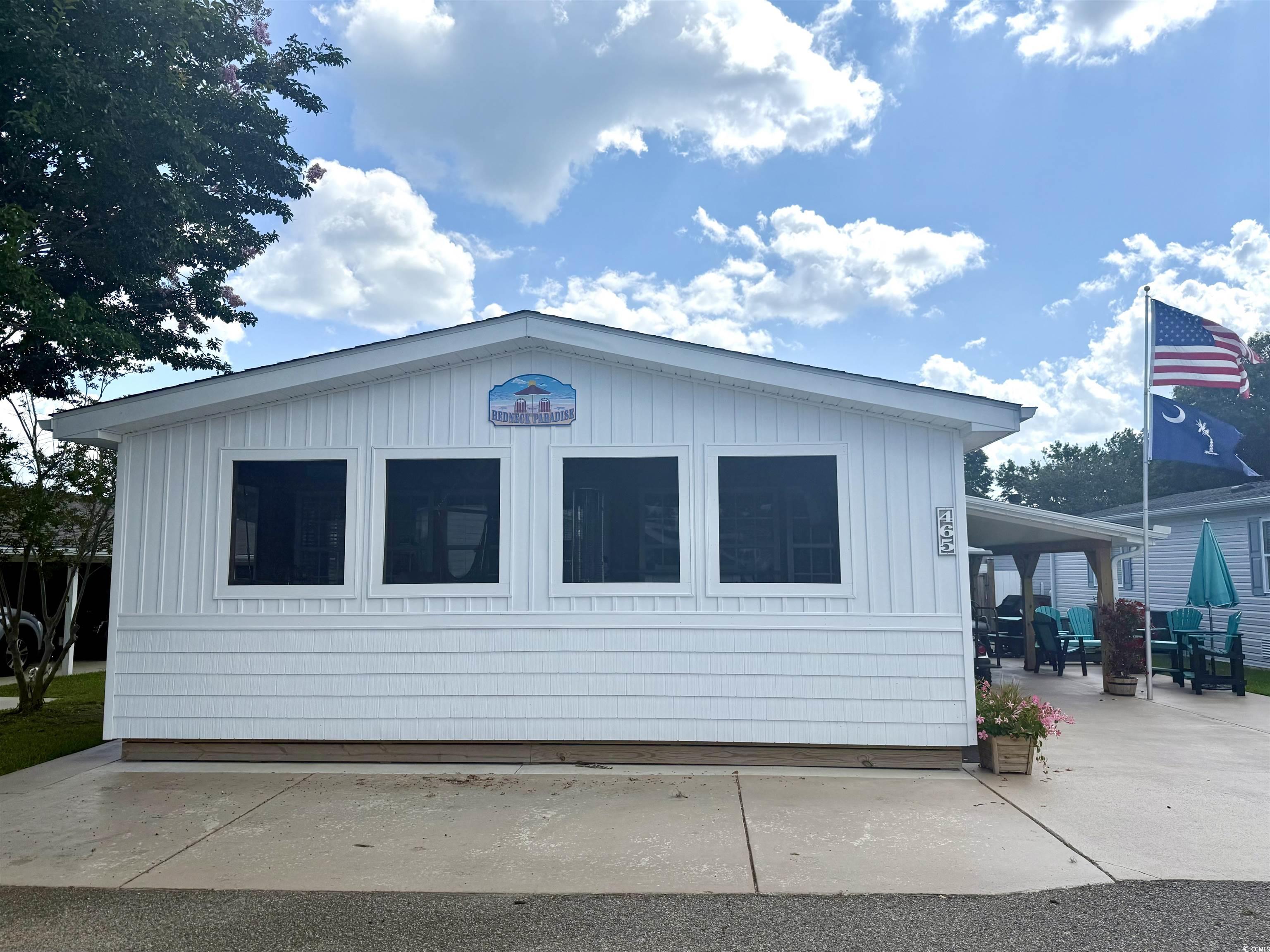 465 Sandpebble Surfside Beach, SC 29575 - Photo 30 of 40 View of property exterior featuring a patio area