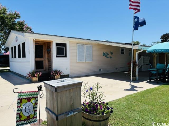 465 Sandpebble Surfside Beach, SC 29575 - Photo 31 of 40 Rear view of property with a patio area