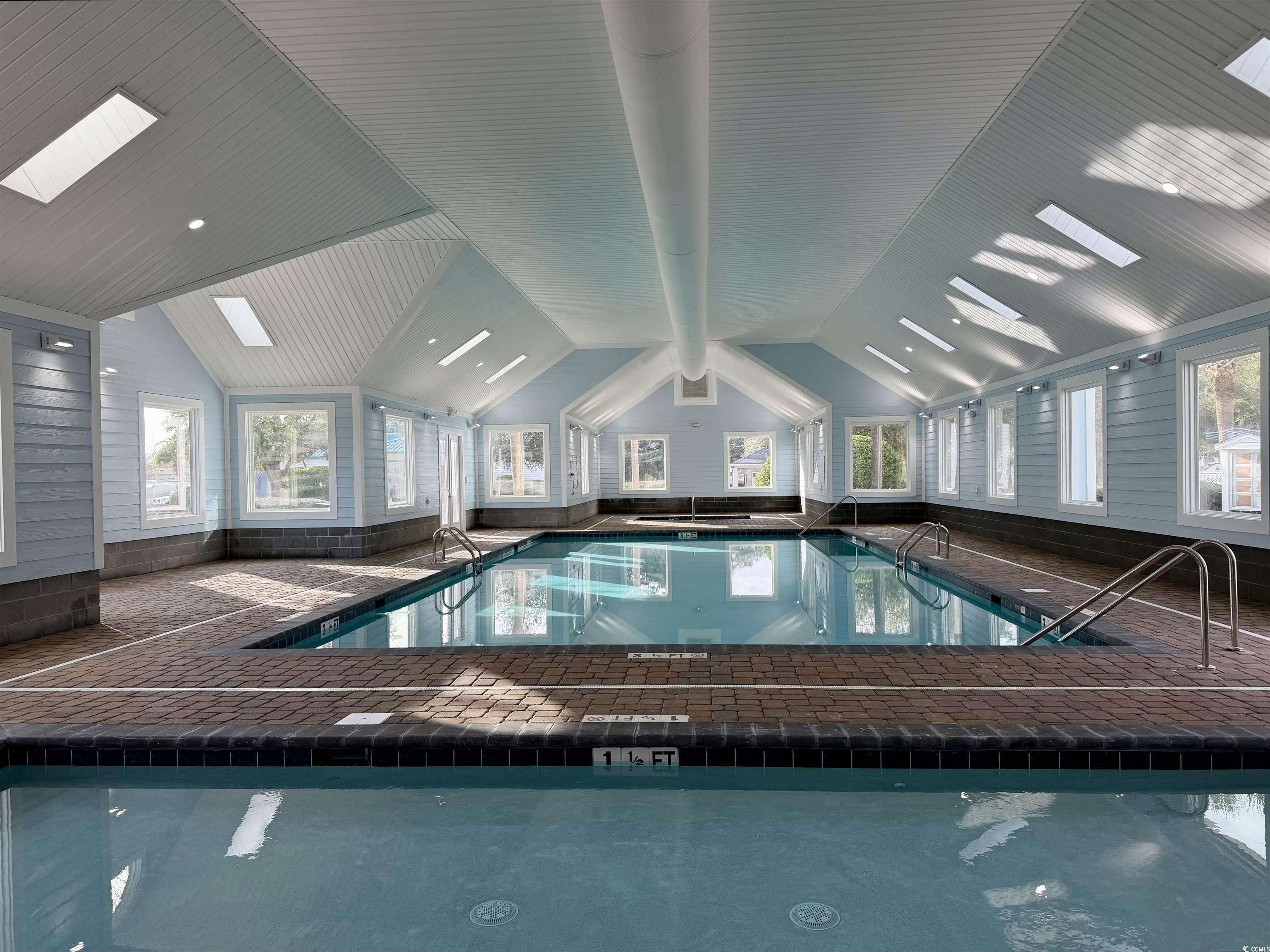 465 Sandpebble Surfside Beach, SC 29575 - Photo 33 of 40 Indoor pool with a skylight