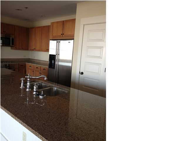2050 Hwy Santa Rosa Beach, Unit M1414 30A Santa Rosa Beach, FL 32459 - Photo 6 of 14 a kitchen with a sink and refrigerator