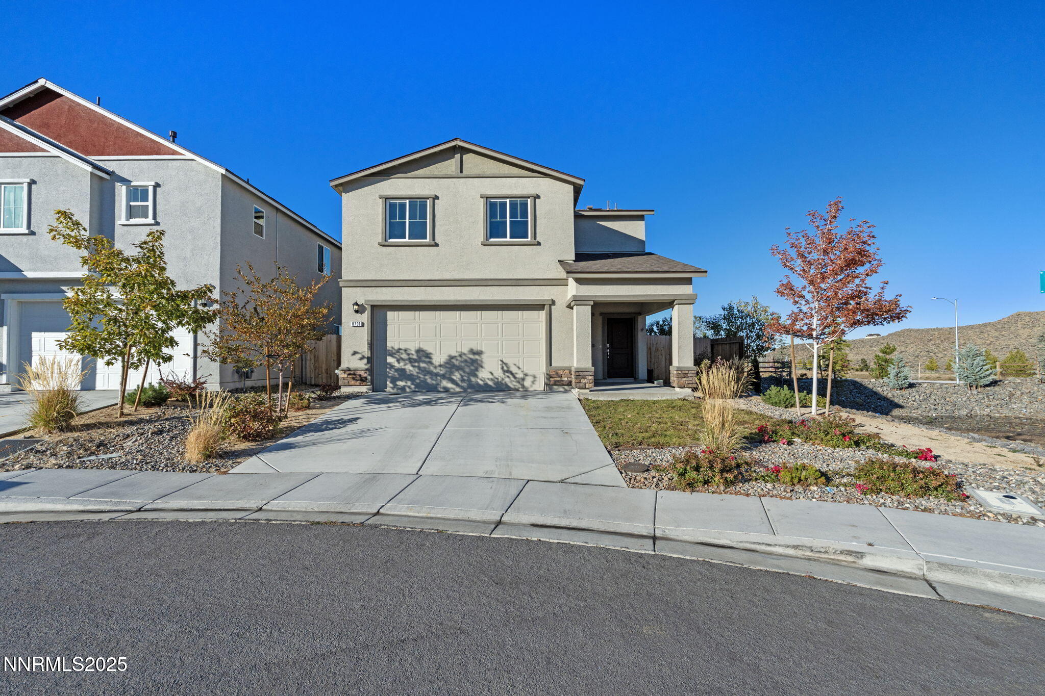 8791 Portia Drive Reno, NV 89506 - Photo 1 of 28 a front view of a house with a yard