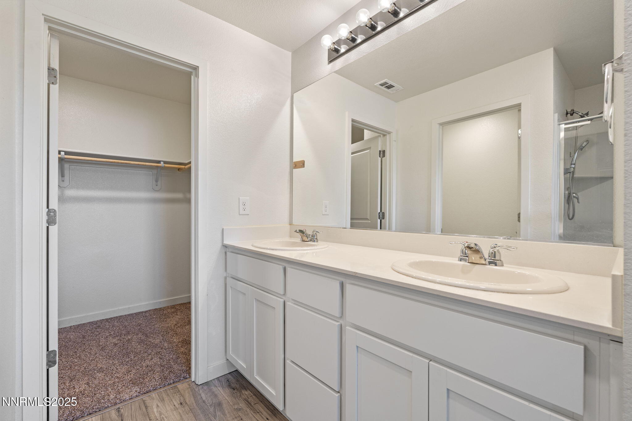 8791 Portia Drive Reno, NV 89506 - Photo 18 of 28 a bathroom with a sink and a mirror