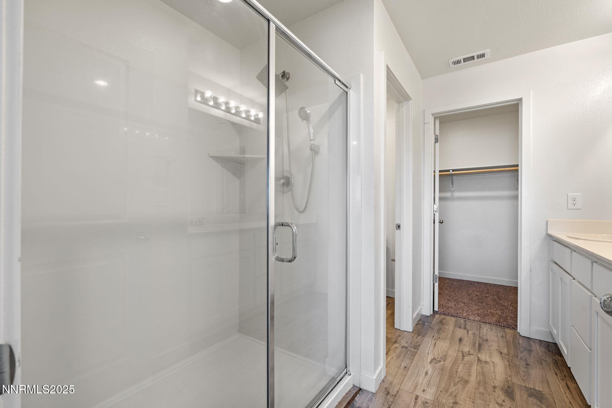 8791 Portia Drive Reno, NV 89506 - Photo 19 of 28 a bathroom with a shower and a glass door